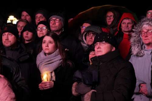 Germans mourn the 5 killed and 200 injured in the apparent attack on a Christmas market